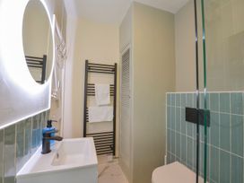 A bathroom with a sink and shower at Woodedge in Minehead