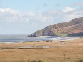 A coastal landscape featuring a beach and cliffs at Woodedge in Minehead