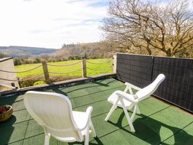 An outdoor area with chairs and a view at No.51 Llanteg Park Amroth