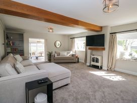 A living room with a sofa and television at Barn Howe Lyth near Levens