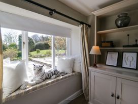 A snug with a window seat and stuffed animal at Barn Howe Lyth near Levens