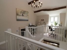 A landing area with a piano and desk at Barn Howe Lyth near Levens