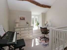 An office with a keyboard and a chair at Barn Howe in Lyth near Levens