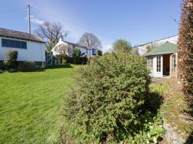 A garden with a bush and a gazebo at Barn Howe in Lyth near Levens