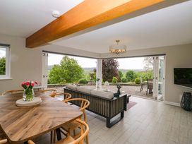 A dining room with a table and chairs at Barn Howe, Lyth near Levens