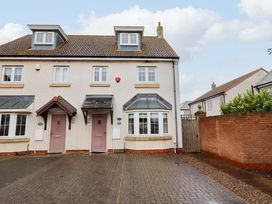 A house exterior with doors and windows at High Sea View