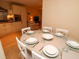 A dining room with a table set for dinner at High Sea View in 