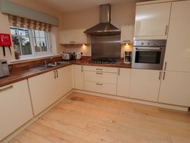 A kitchen with a sink and stove at High Sea View