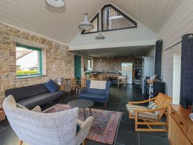 A living room with a sofa and coffee table at The Barn in Newport