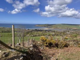 A landscape view of the ocean and hills at The Barn in Newport, Pembrokeshire
