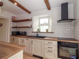 A kitchen with a sink and countertop at The Farmhouse in Tralee, County Kerry