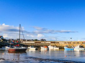 A view of boats in a harbour at 2 Harbour Lights Cemaes Bay