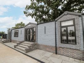 An exterior view of a mobile home with steps at The Cabin in Thornton Dale