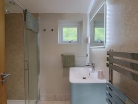 A bathroom with a shower and sink at The Roost in Whitford Nr. Colyton