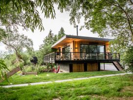 A house with a deck and hammock in the outdoor area at The Red House Farndon