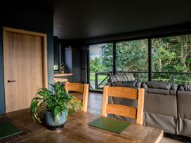 A dining room with a table and chairs at The Red House in Farndon