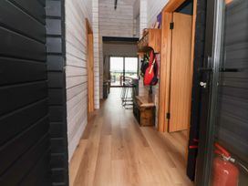 A hallway with a table and chairs at The Larch House Farndon