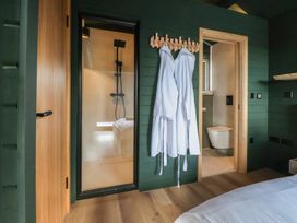 A bathroom with a shower and toilet at The Larch House in Farndon