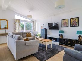 A living room with a sofa and coffee table at Cedar 1 Pinewood Retreat in Rousdon near Lyme Regis