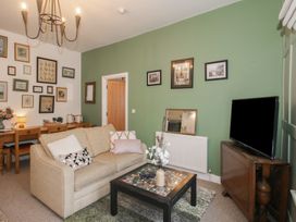 A living room with a sofa and coffee table at Apartment 2 The Bridge at Stanford Hotel near Great Witley