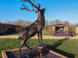 A stag statue in front of a holiday home at Meadows Park 2 Great Hatfield near Hornsea