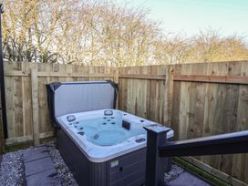 A hot tub in an outdoor area at Meadows Park 2 Great Hatfield near Hornsea