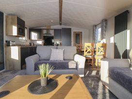 A living room with sofa and dining table at Meadows Park 3 Great Hatfield near Hornsea