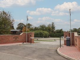 An entrance gate with a sign at The Meadows Park 5 Great Hatfield near Hornsea