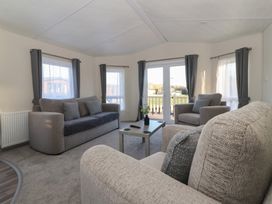 A living room with sofas and a coffee table at Meadows Park 5 Great Hatfield near Hornsea