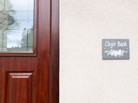 A door with a nameplate at Clegir Bach in Corwen