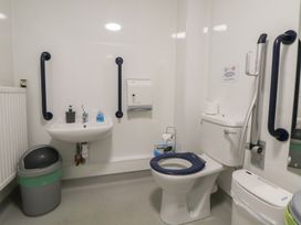 A bathroom with a sink and toilet at Clwyd Special Riding Centre