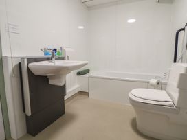 A bathroom with a sink, toilet, and bathtub at Clwyd Special Riding Centre in 