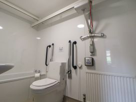 A bathroom with a toilet and sink at Clwyd Special Riding Centre 