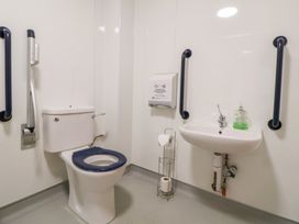 A bathroom with a toilet and sink at Clwyd Special Riding Centre