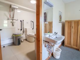 A bathroom with a toilet and sink at Clwyd Special Riding Centre