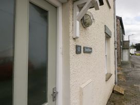An entrance door with house number at Swirl Howe in Keswick