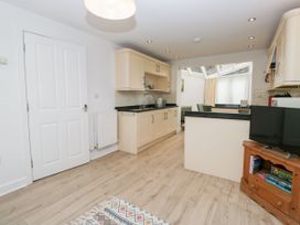 A kitchen with cabinets and a sink at Swirl Howe in Keswick