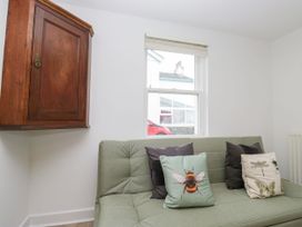 A living room with a sofa and cushions at Swirl Howe in Keswick