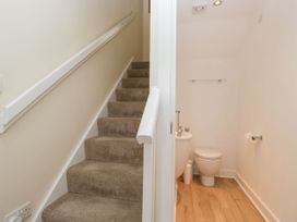 A bathroom with a toilet and sink at Swirl Howe in Keswick
