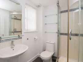 A bathroom with a sink, toilet, and shower at Swirl Howe in Keswick