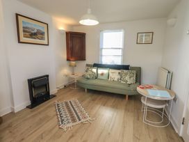 A living room with a sofa and coffee table at Swirl Howe in Keswick
