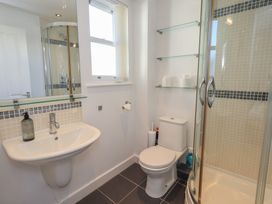 A bathroom with a sink, toilet, and shower at Swirl Howe in Keswick