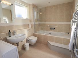 A bathroom with a shower and bathtub at Swirl Howe in Keswick