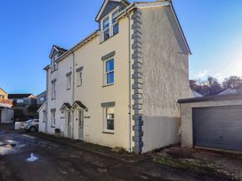 An exterior view of a house with a garage at Swirl Howe in Keswick