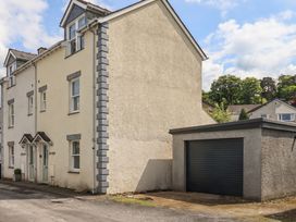 A house with a garage beside it at Swirl Howe in Keswick