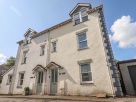A two-story building exterior with two doors at Swirl Howe in Keswick
