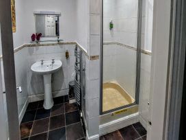 A bathroom with a sink and shower at 1 Park Road Windermere