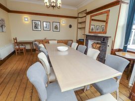 A dining room with a large table and chairs at 1 Park Road in Windermere