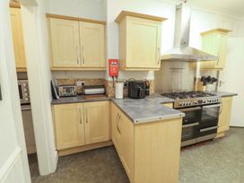A kitchen with cabinets and countertop at 1 Park Road in Windermere