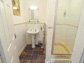 A bathroom with a sink and shower at 1 Park Road in Windermere